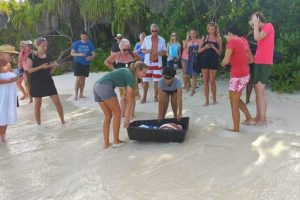 ORP Volunteers and Coco Palm guests getting ready to release Beyonce and Noor on the beach