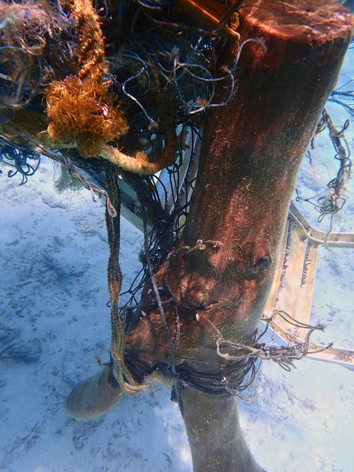 Ghost net with tree trunk entangled North Male Atoll Maldives