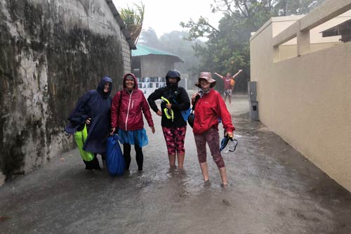 Splashing through monsoon rain Maldives