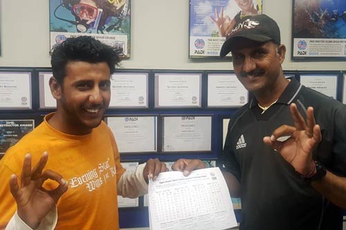 Alam and Asif Baloch after passing the PADI Open Water Certification exam.