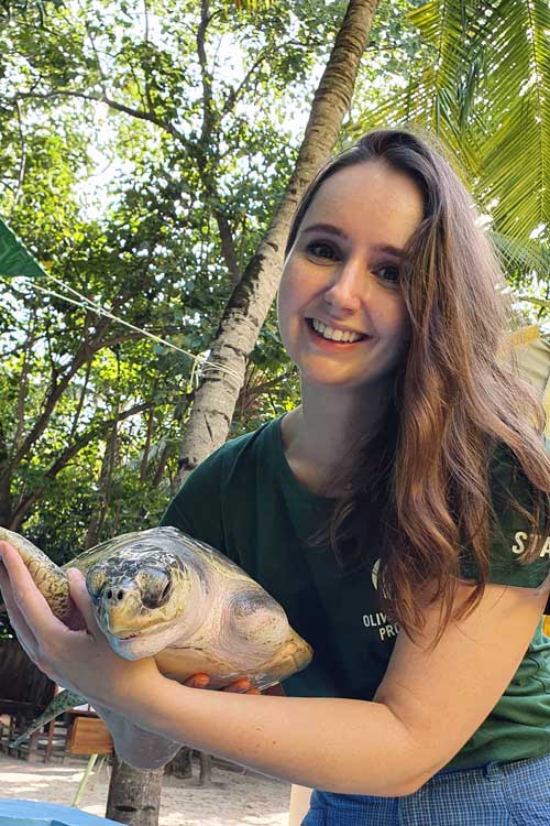 Turtle Vet Dr. Minnie with turtle patient Arti. Image.