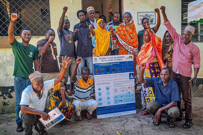 ORP - Kenya team members with fishers from Munje BMU in Kenya celebrating a successful sea turtle workshop. Image.