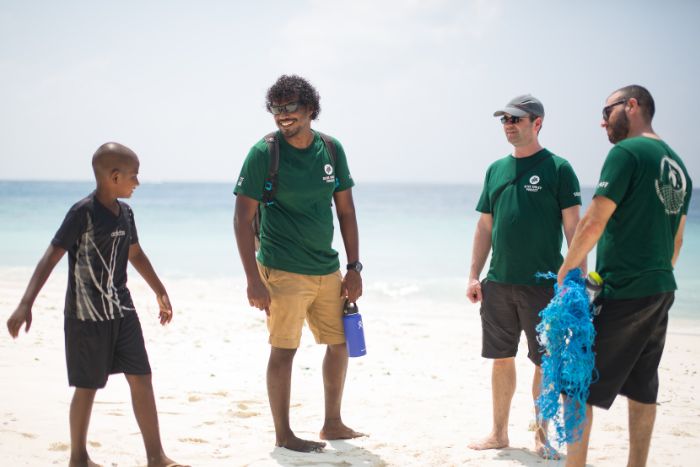 Martin carrying a ghost net in Maldives. Image.